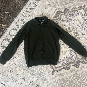 Green sweater with tags